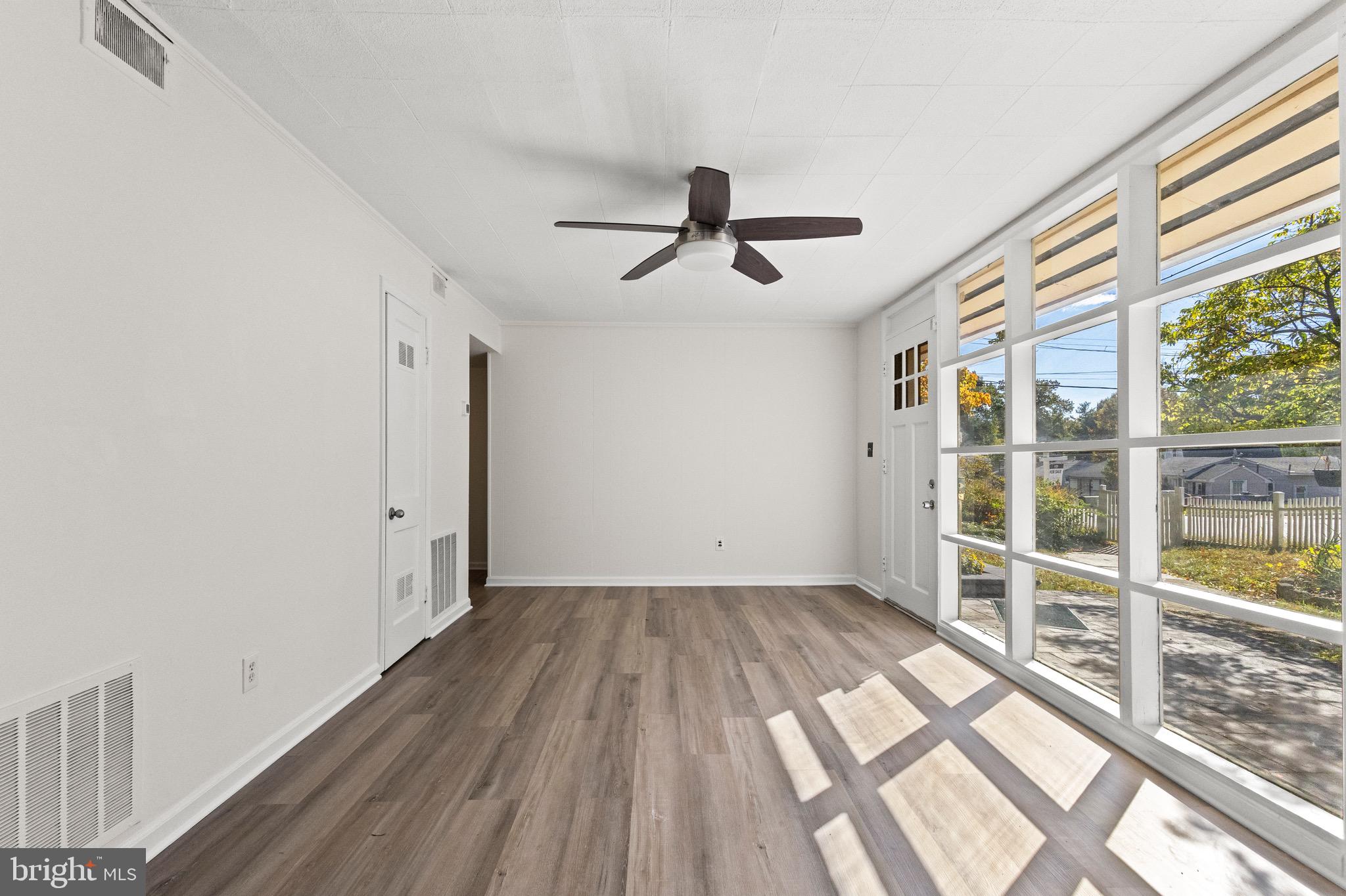 5120 Kenesaw Street College Park, MD 20740 - Photo 8 of 37 a view of empty room with wooden floor and fan