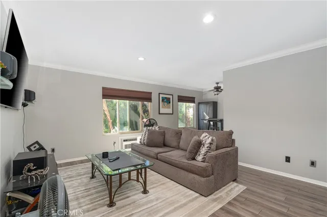 a living room with furniture and a window