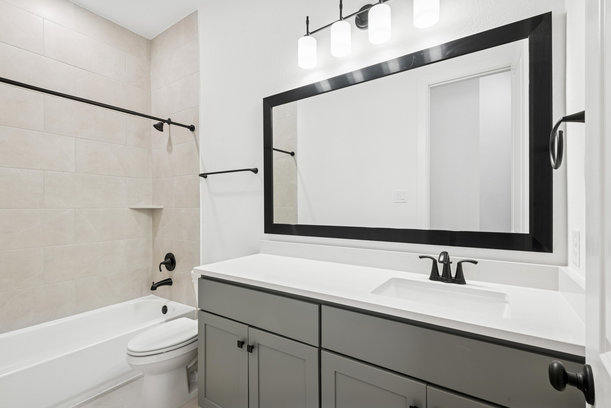 15714 Terracotta Terrace Lane Conroe, TX 77302 - Photo 19 of 47 a bathroom with a granite countertop sink a toilet and a large mirror