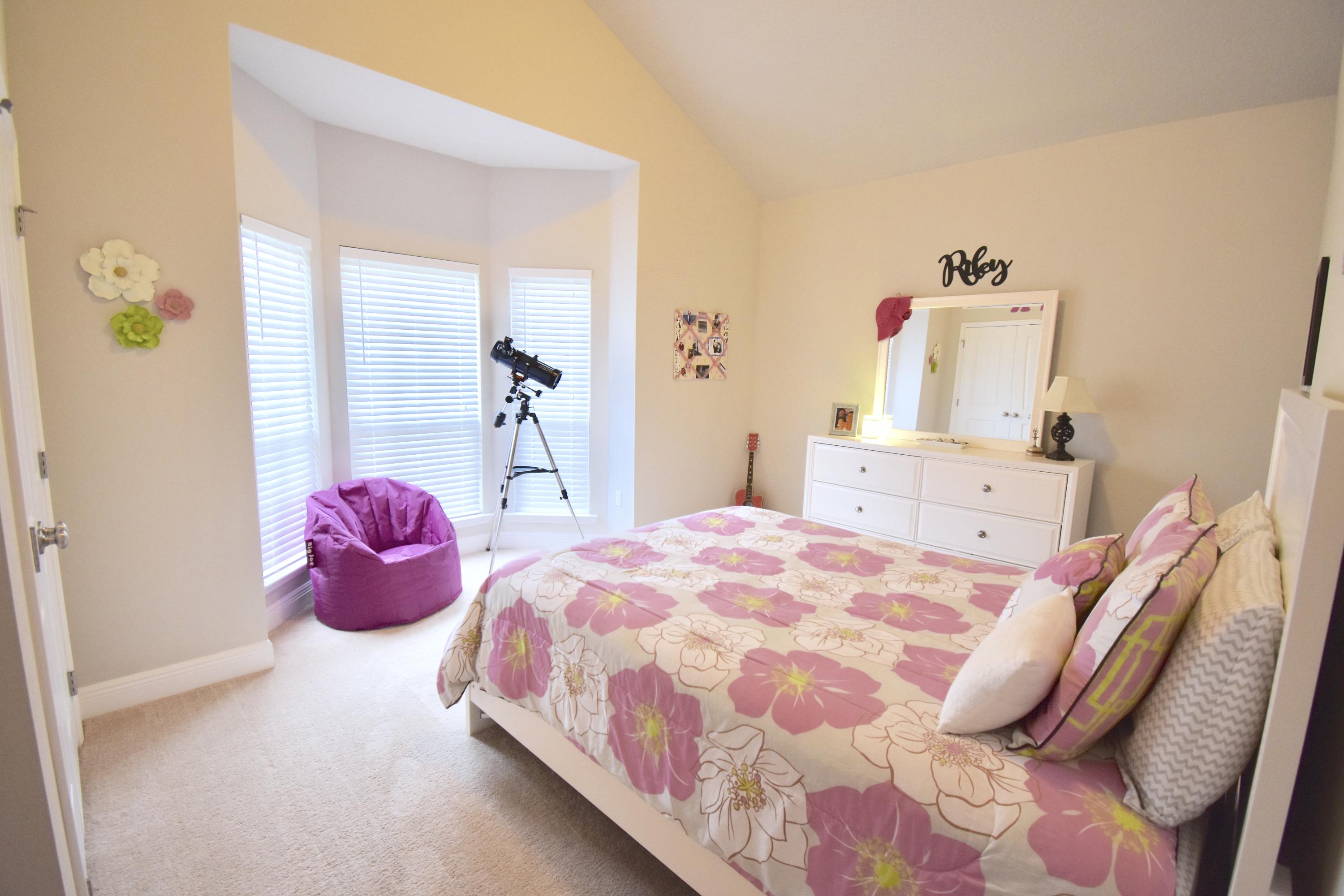 685 Cocobolo Drive Santa Rosa Beach, FL 32459 - Photo 12 of 16 a bedroom with a bed and wooden floor