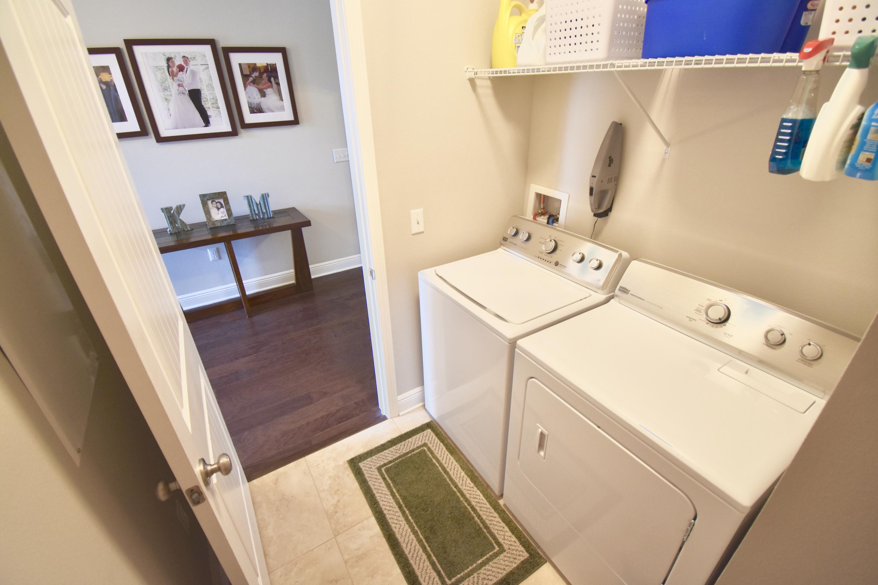 685 Cocobolo Drive Santa Rosa Beach, FL 32459 - Photo 15 of 16 a utility room with dryer and washer