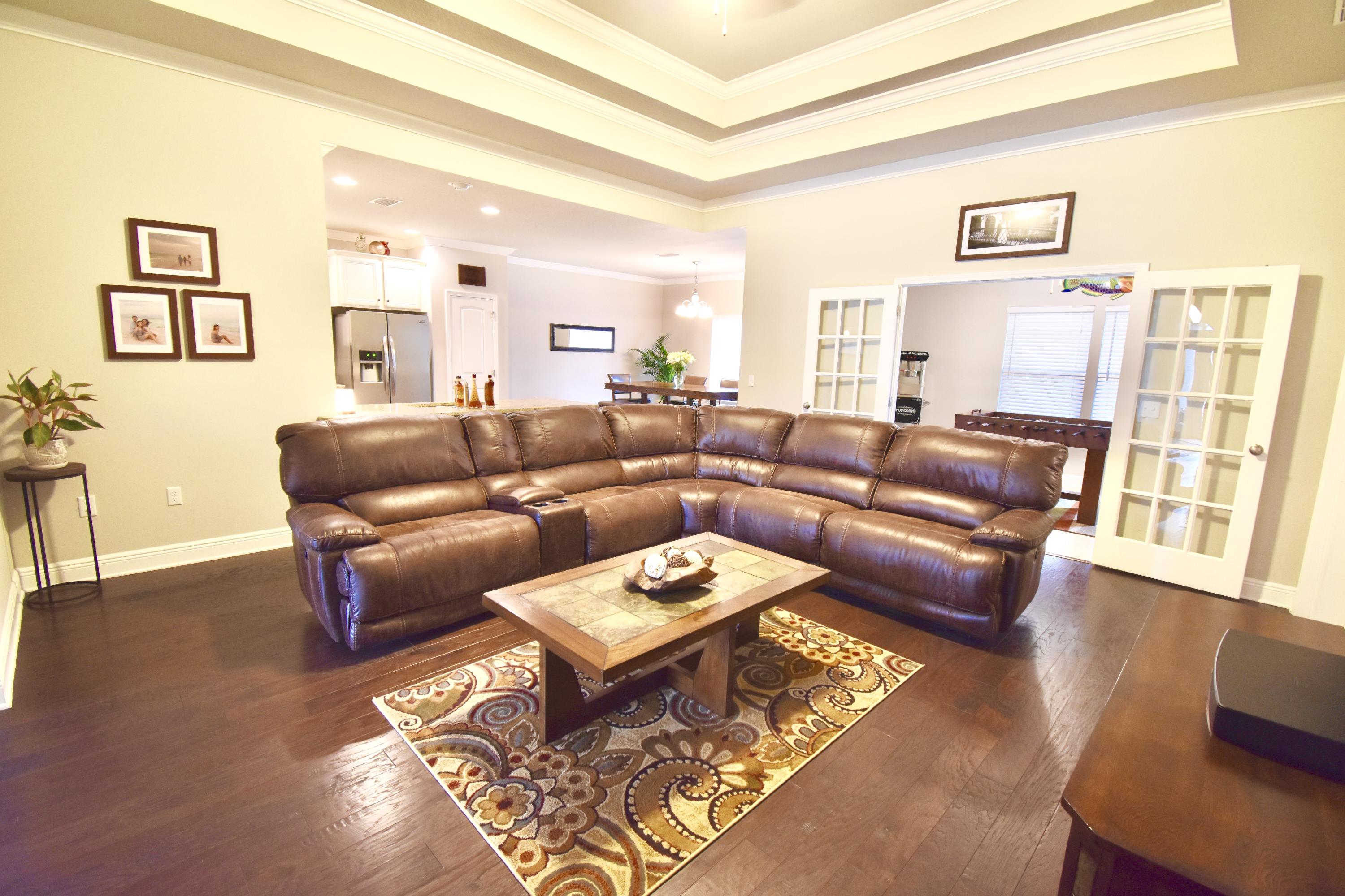 685 Cocobolo Drive Santa Rosa Beach, FL 32459 - Photo 3 of 16 a living room with furniture and a wooden floor