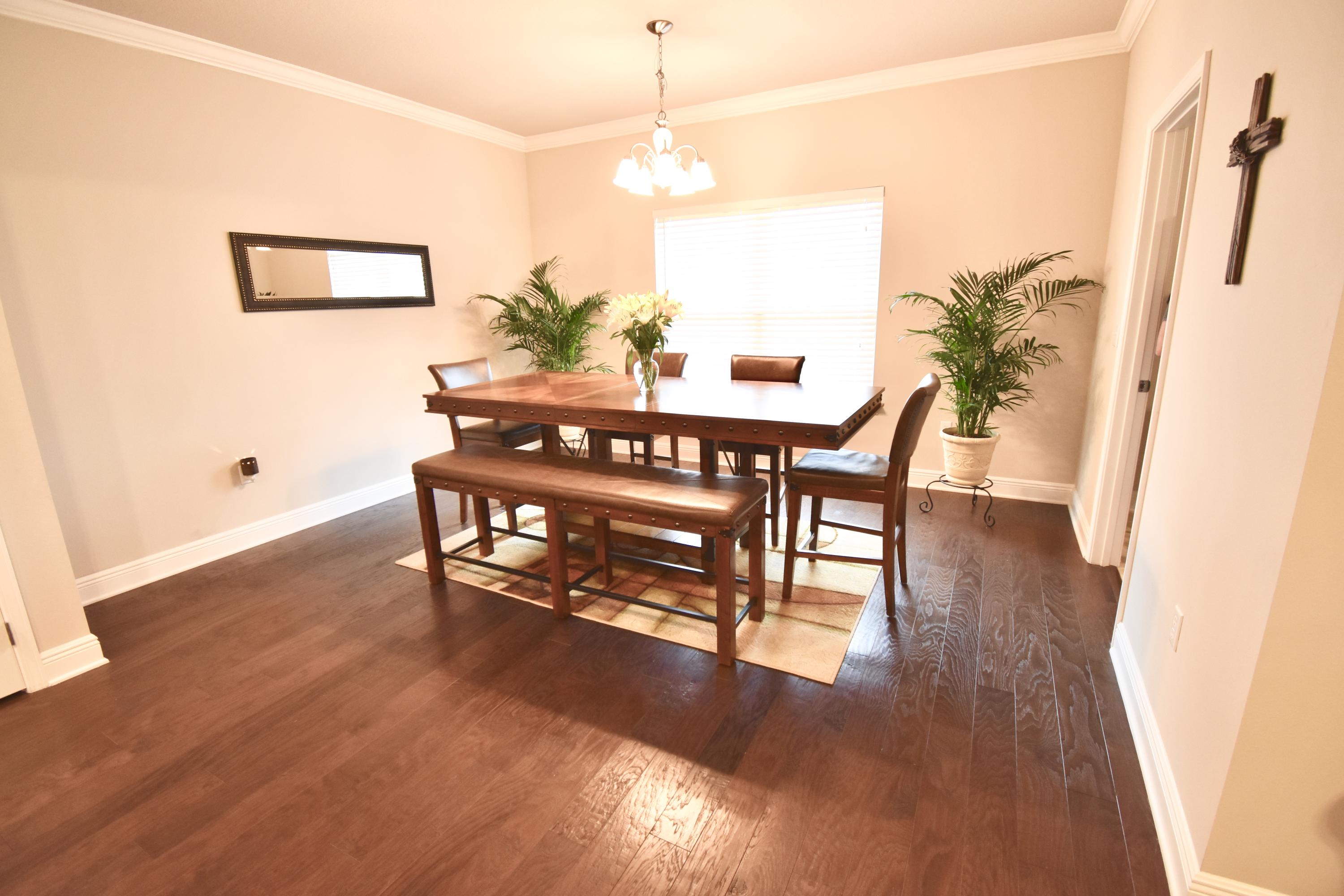 685 Cocobolo Drive Santa Rosa Beach, FL 32459 - Photo 5 of 16 a view of a room with furniture and wooden floor