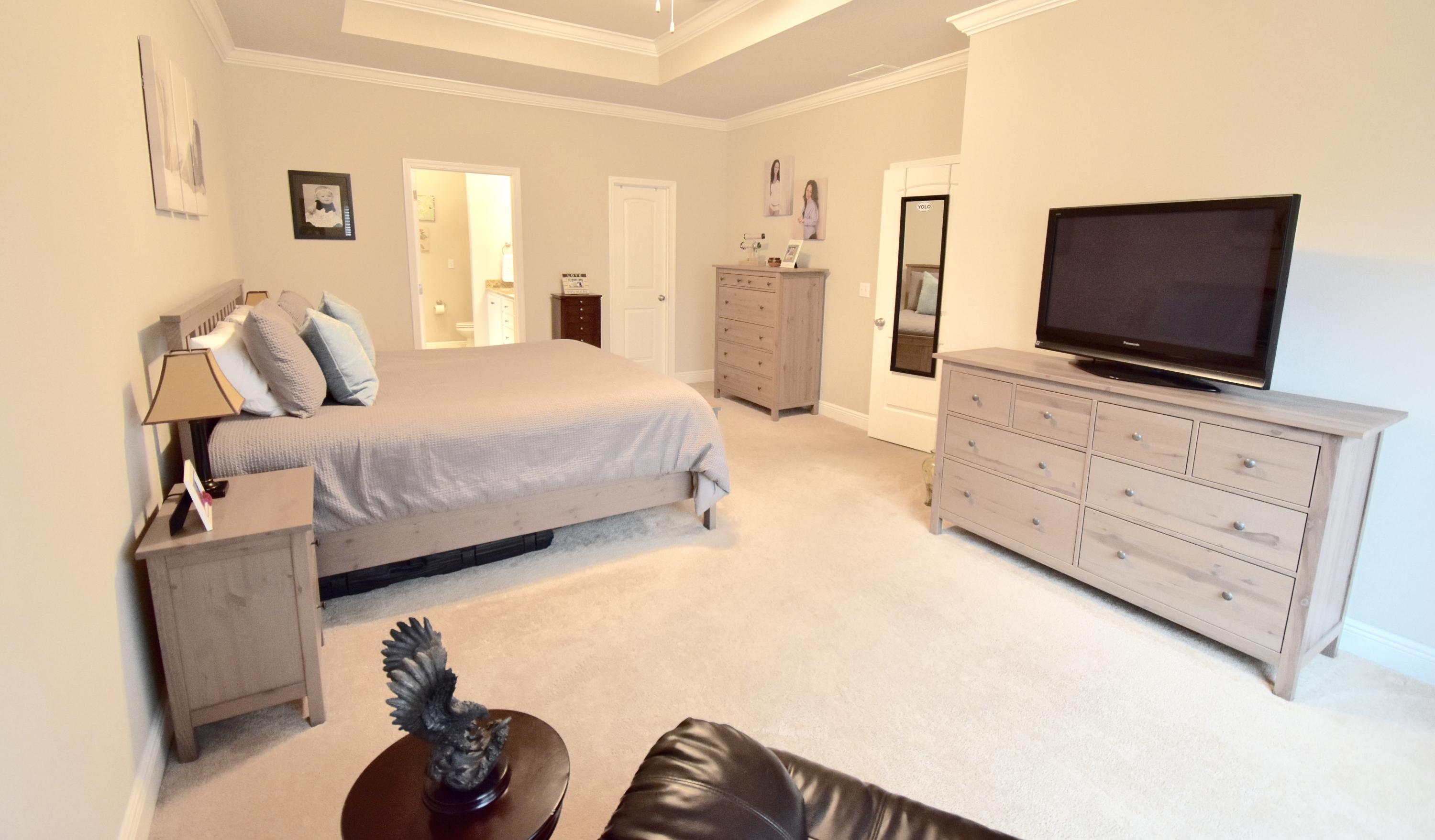 685 Cocobolo Drive Santa Rosa Beach, FL 32459 - Photo 9 of 16 a bedroom with furniture and a flat screen tv