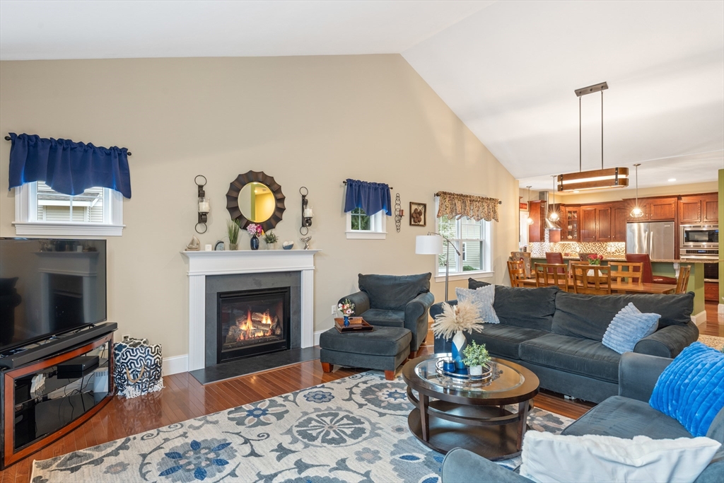 4 Hawthorne Path, Unit 4 Milford, MA 01757 - Photo 12 of 28 a living room with furniture and a fireplace