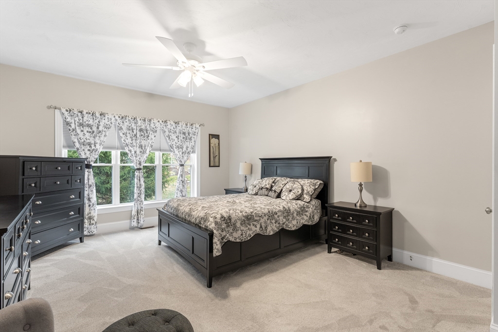 4 Hawthorne Path, Unit 4 Milford, MA 01757 - Photo 13 of 28 a spacious bedroom with a bed and dresser