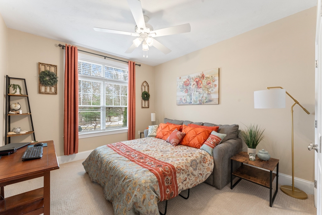 4 Hawthorne Path, Unit 4 Milford, MA 01757 - Photo 18 of 28 a bedroom with a bed and a window