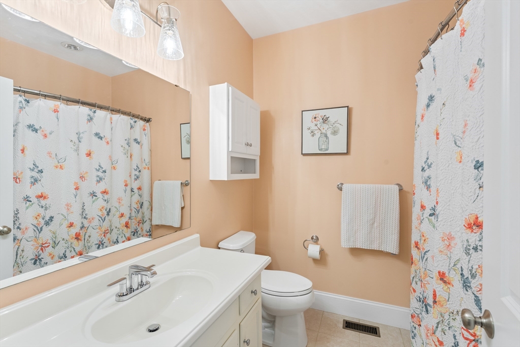 4 Hawthorne Path, Unit 4 Milford, MA 01757 - Photo 20 of 28 a bathroom with a sink and a toilet