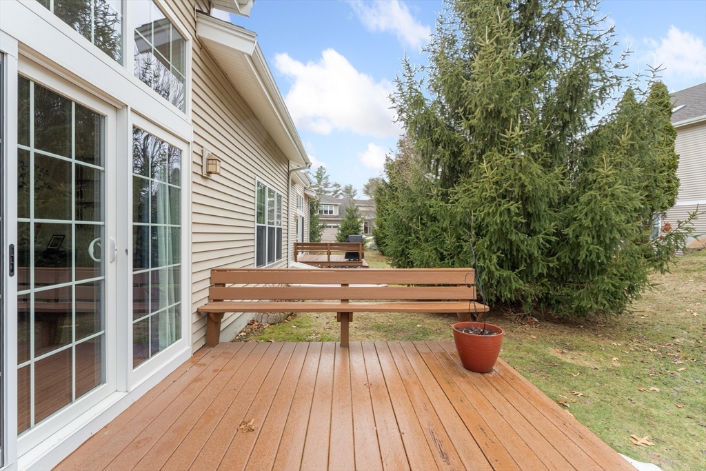 4 Hawthorne Path, Unit 4 Milford, MA 01757 - Photo 23 of 28 a view of a chairs and tables in the balcony