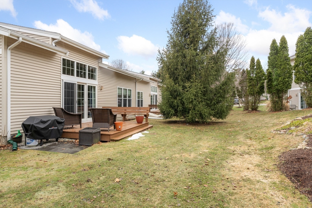 4 Hawthorne Path, Unit 4 Milford, MA 01757 - Photo 24 of 28 a view of a house with backyard and sitting area