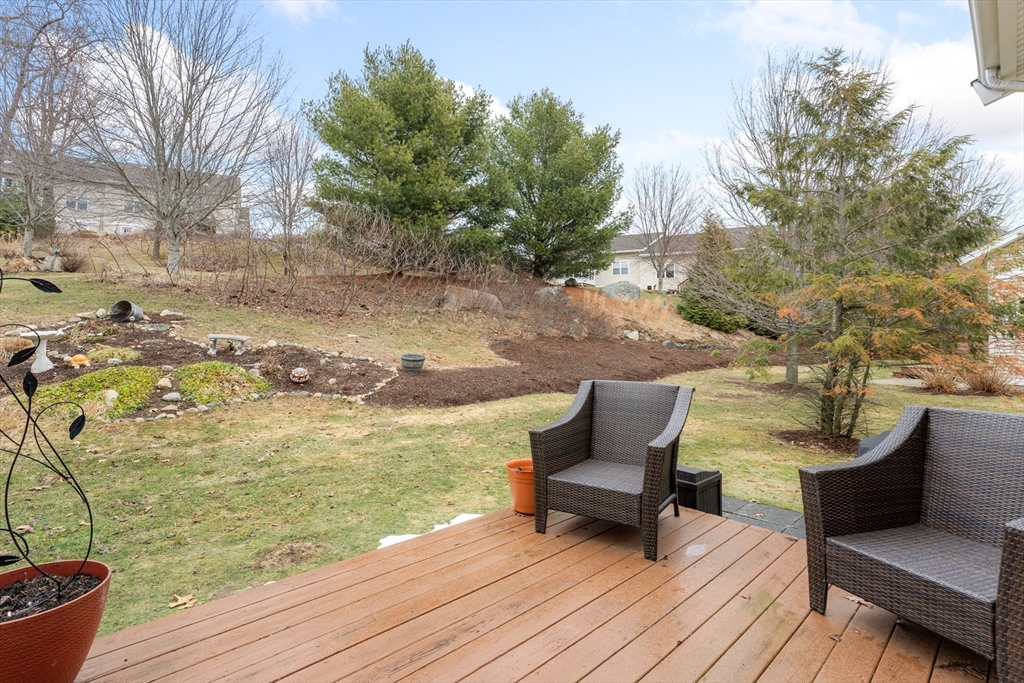 4 Hawthorne Path, Unit 4 Milford, MA 01757 - Photo 25 of 28 a view of a terrace with seating space