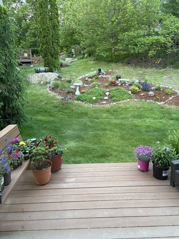 4 Hawthorne Path, Unit 4 Milford, MA 01757 - Photo 27 of 28 a garden view with a fountain