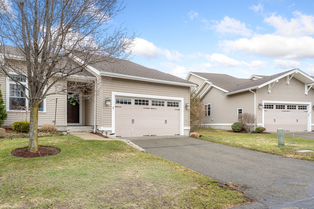 4 Hawthorne Path, Unit 4 Milford, MA 01757 - Photo 3 of 28 a view of a house with a patio and a yard