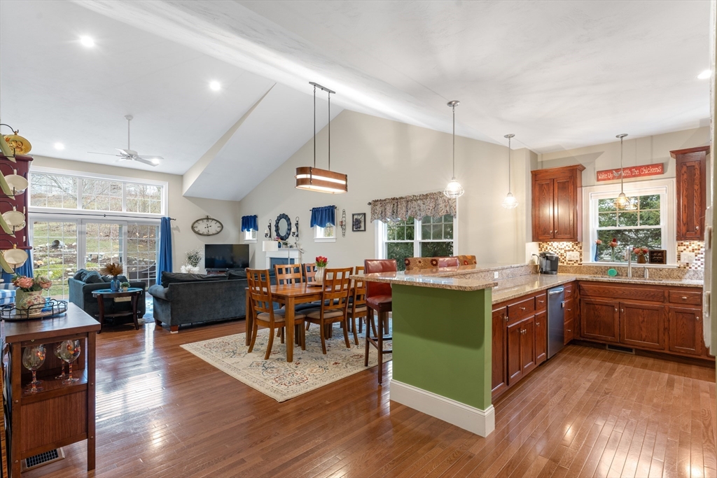 4 Hawthorne Path, Unit 4 Milford, MA 01757 - Photo 8 of 28 a kitchen with kitchen island granite countertop a sink and stove