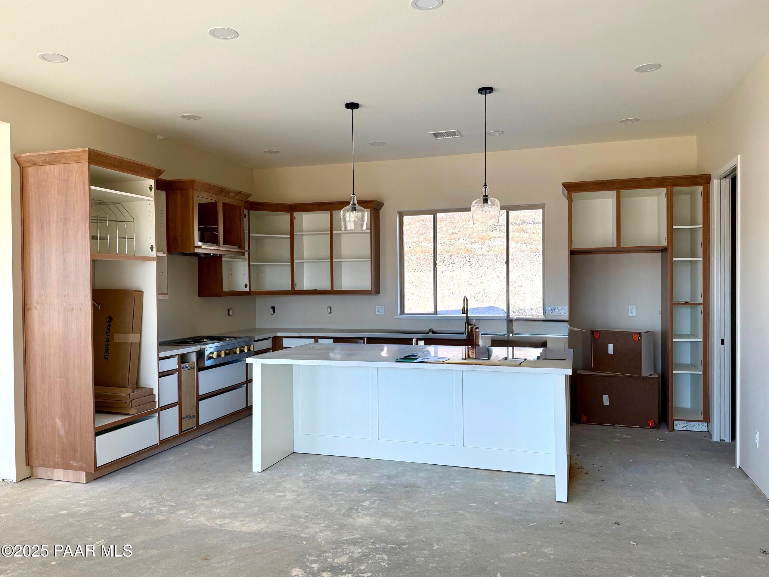 3600 Friendly Meadow Road Prescott, AZ 86305 - Photo 8 of 39 a kitchen with stainless steel appliances granite countertop a sink a stove and a refrigerator