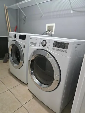 a utility room with dryer and washer