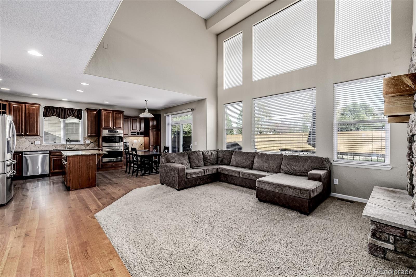 139 Muscovey Lane Johnstown, CO 80534 - Photo 11 of 49 a living room with furniture kitchen view and a large window