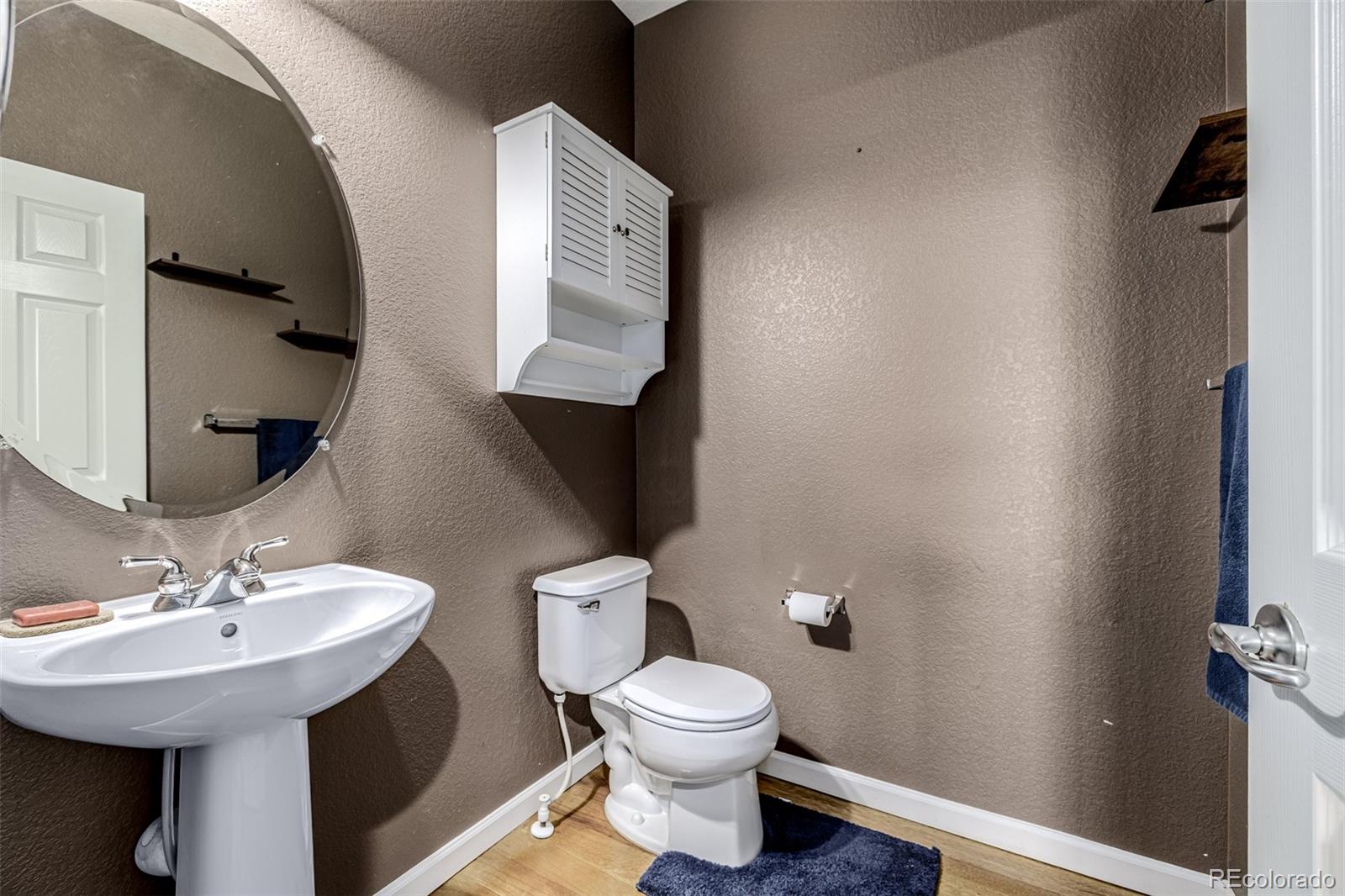 139 Muscovey Lane Johnstown, CO 80534 - Photo 17 of 49 a bathroom with a toilet sink and mirror