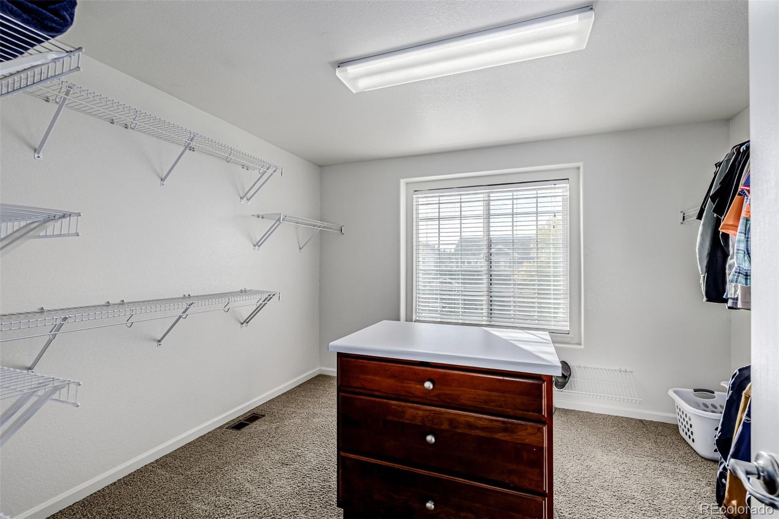 139 Muscovey Lane Johnstown, CO 80534 - Photo 21 of 49 a room with a window and a dresser