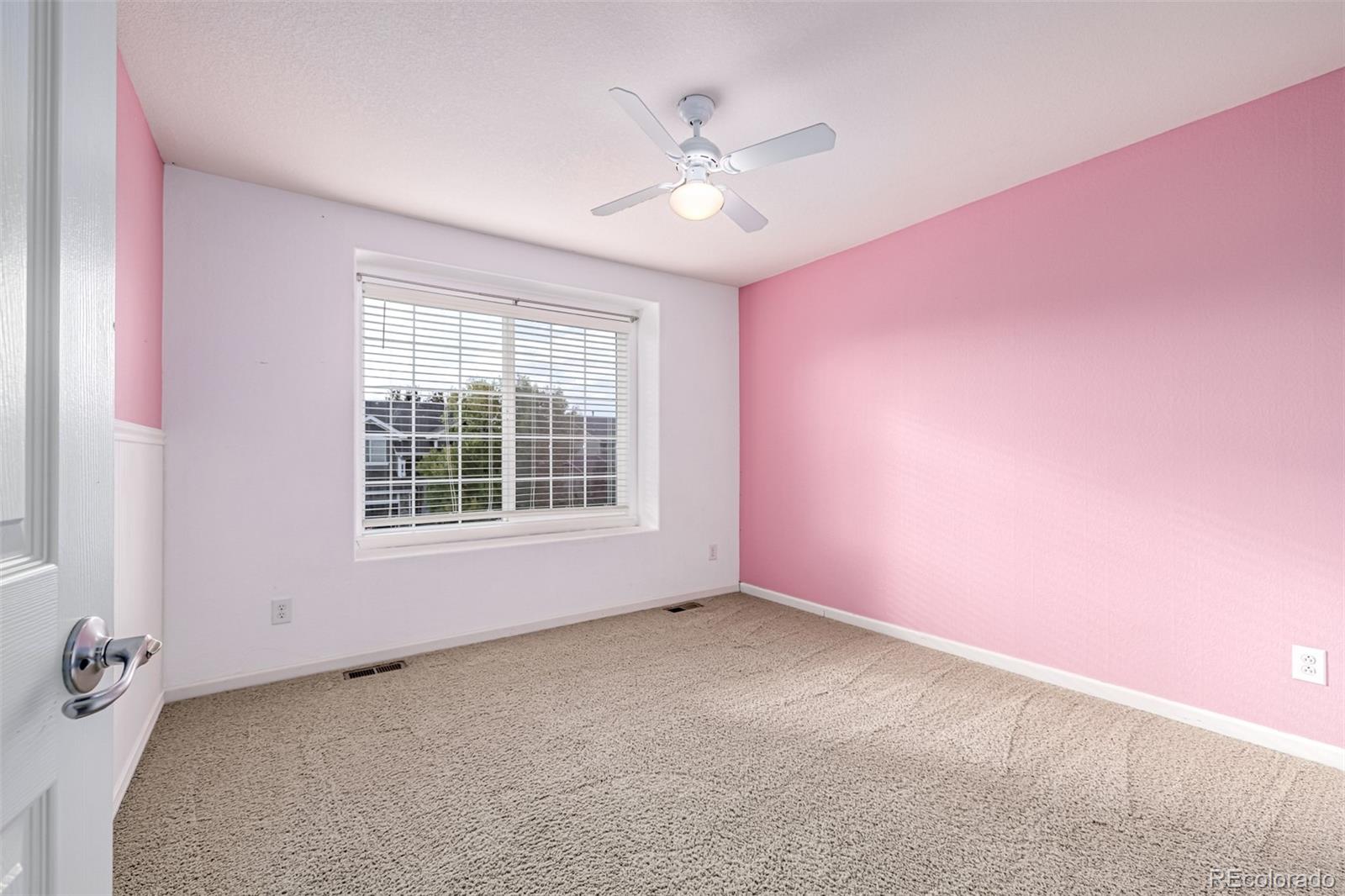 139 Muscovey Lane Johnstown, CO 80534 - Photo 26 of 49 an empty room with a ceiling fan and window
