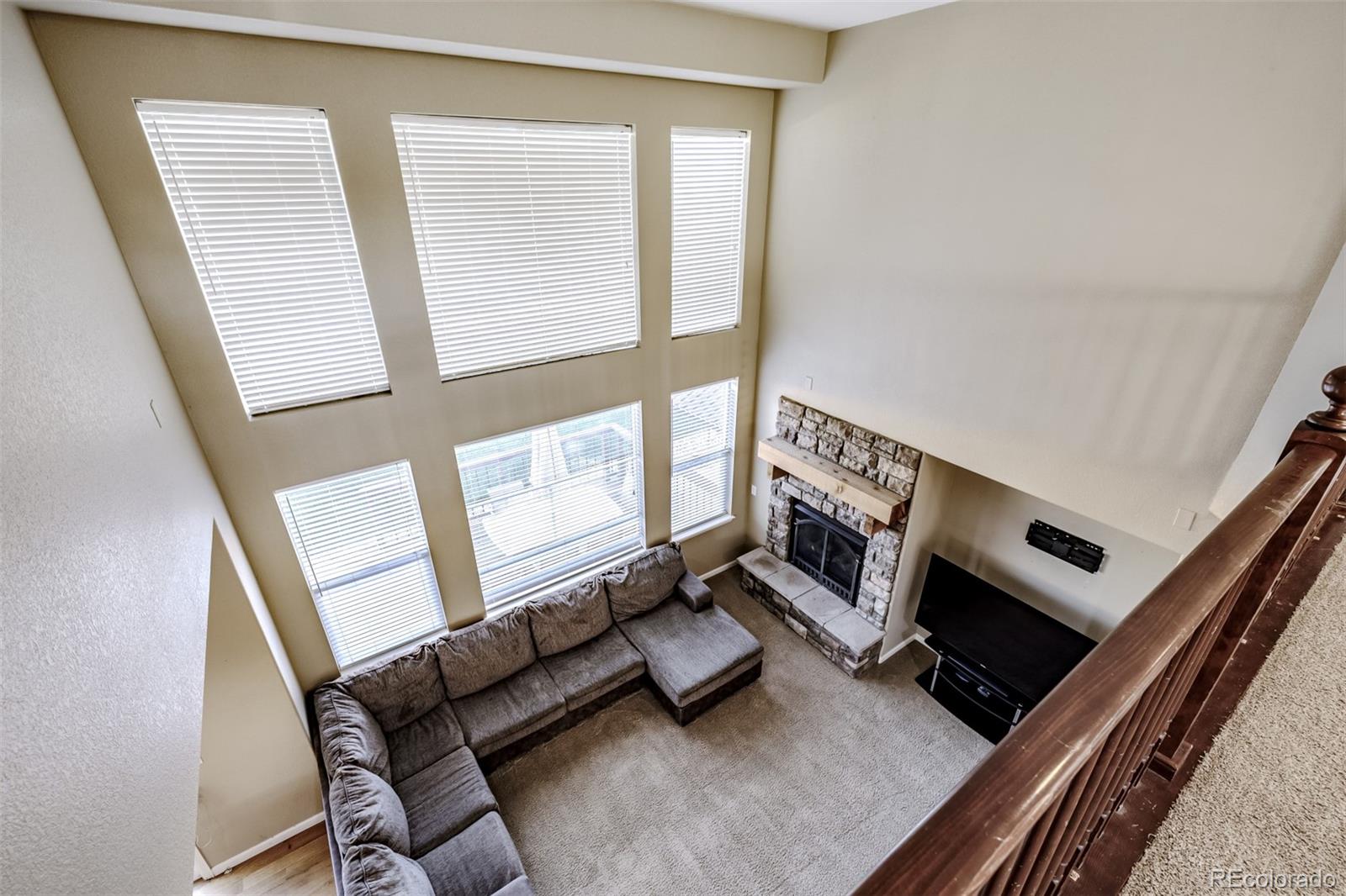 139 Muscovey Lane Johnstown, CO 80534 - Photo 27 of 49 a living room with furniture and a fireplace