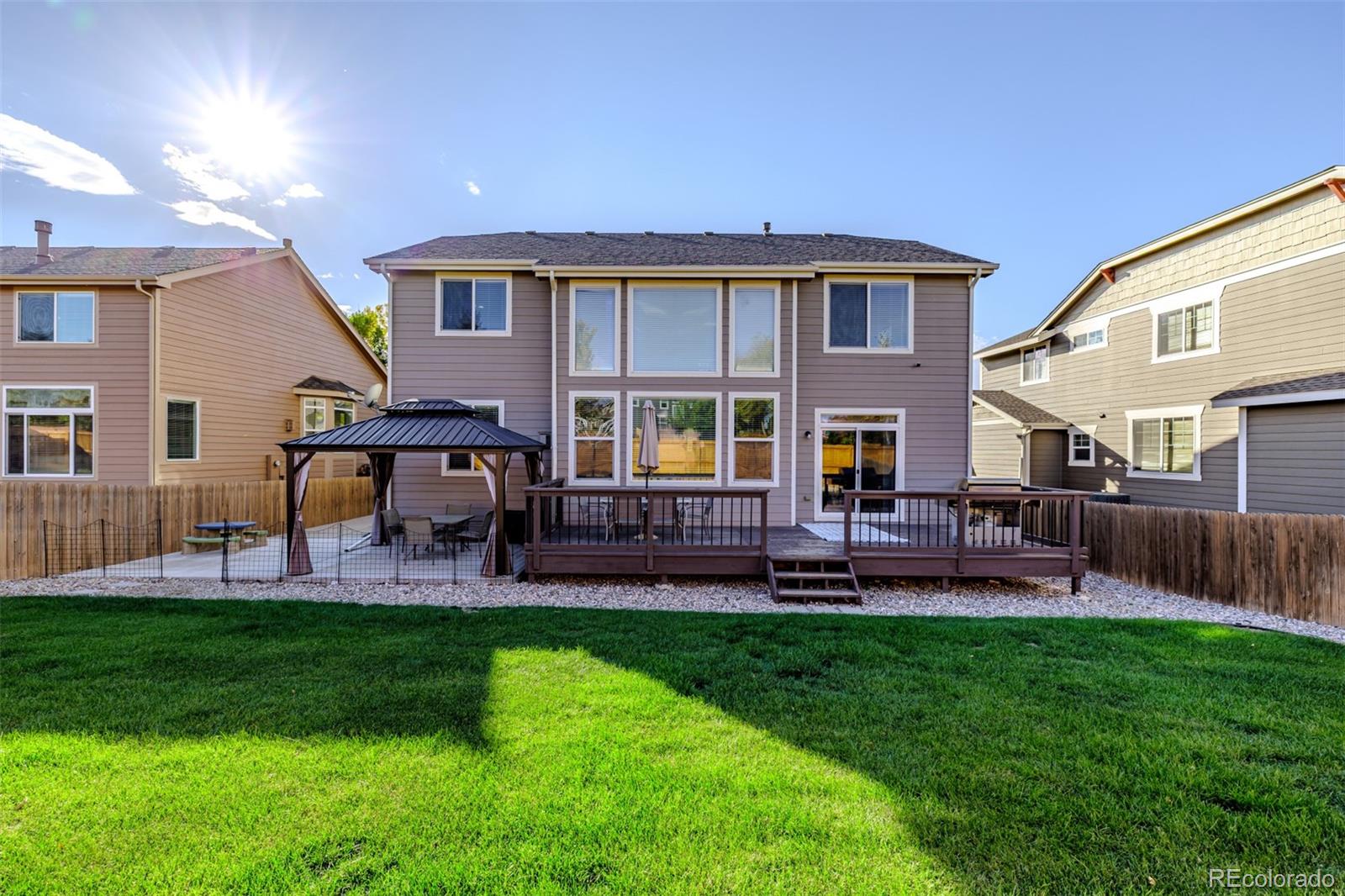 139 Muscovey Lane Johnstown, CO 80534 - Photo 33 of 49 a view of a house with a yard and sitting area