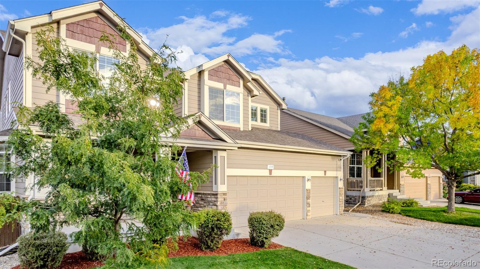 139 Muscovey Lane Johnstown, CO 80534 - Photo 44 of 49 a front view of a house with garden