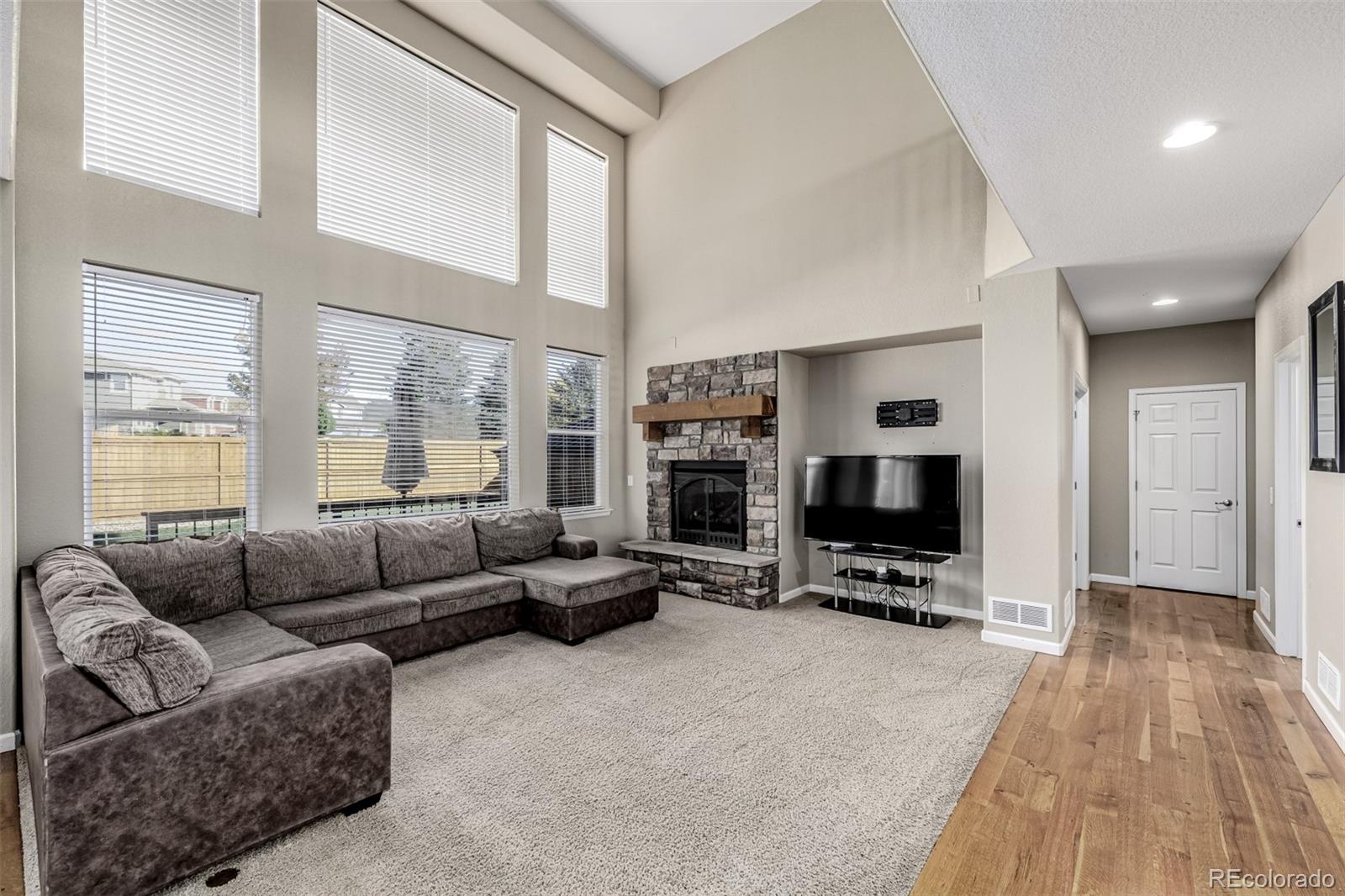 139 Muscovey Lane Johnstown, CO 80534 - Photo 48 of 49 a living room with furniture window and a flat screen tv