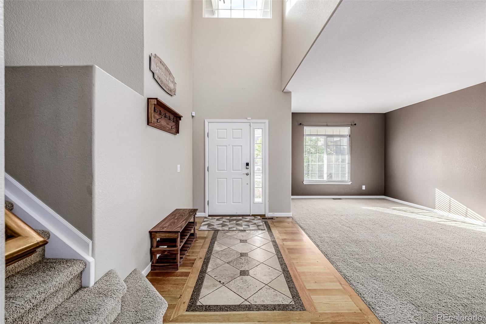 139 Muscovey Lane Johnstown, CO 80534 - Photo 5 of 49 a view of a livingroom with wooden floor and a window