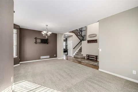 a view of an empty room with stairs