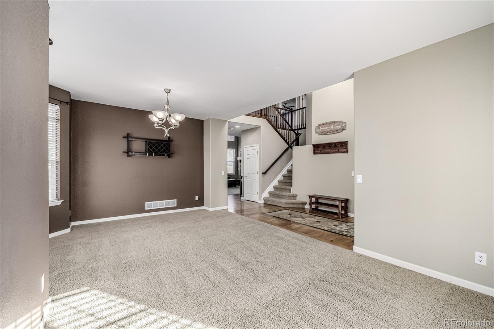 139 Muscovey Lane Johnstown, CO 80534 - Photo 8 of 49 a view of an empty room with stairs