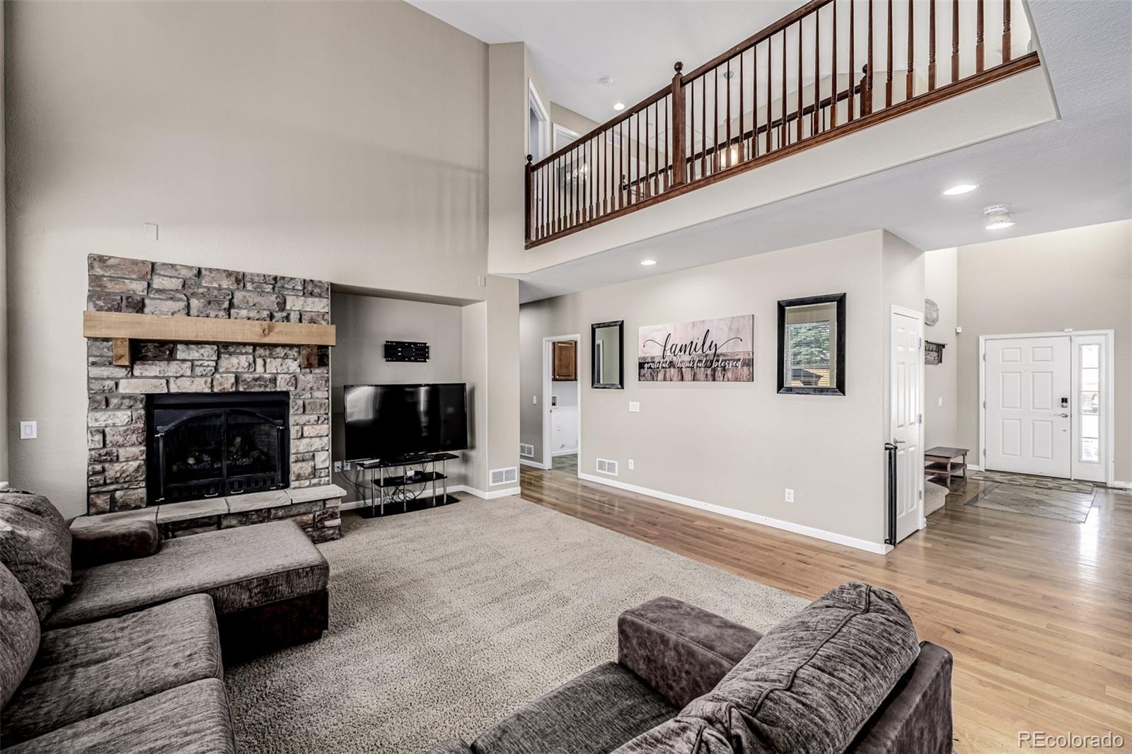 139 Muscovey Lane Johnstown, CO 80534 - Photo 9 of 49 a living room with furniture and a fireplace