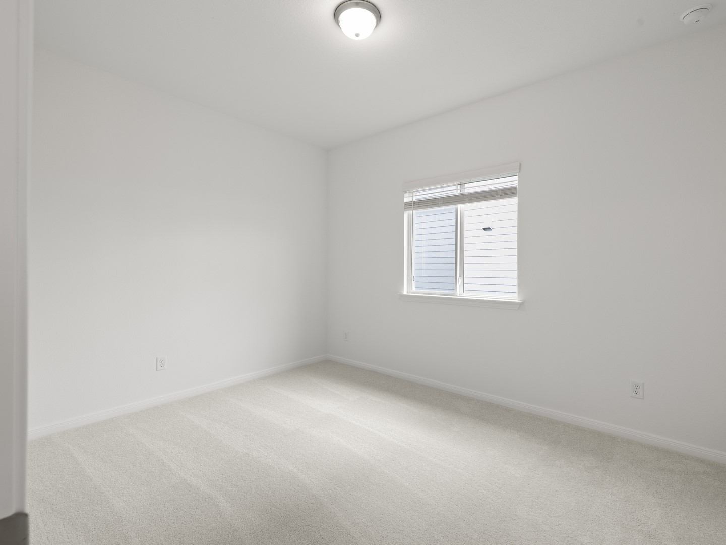 513 Yellow Ribbon Trail Jarrell, TX 76537 - Photo 13 of 23 An airy bedroom with fresh carpeting, ready for personalization.