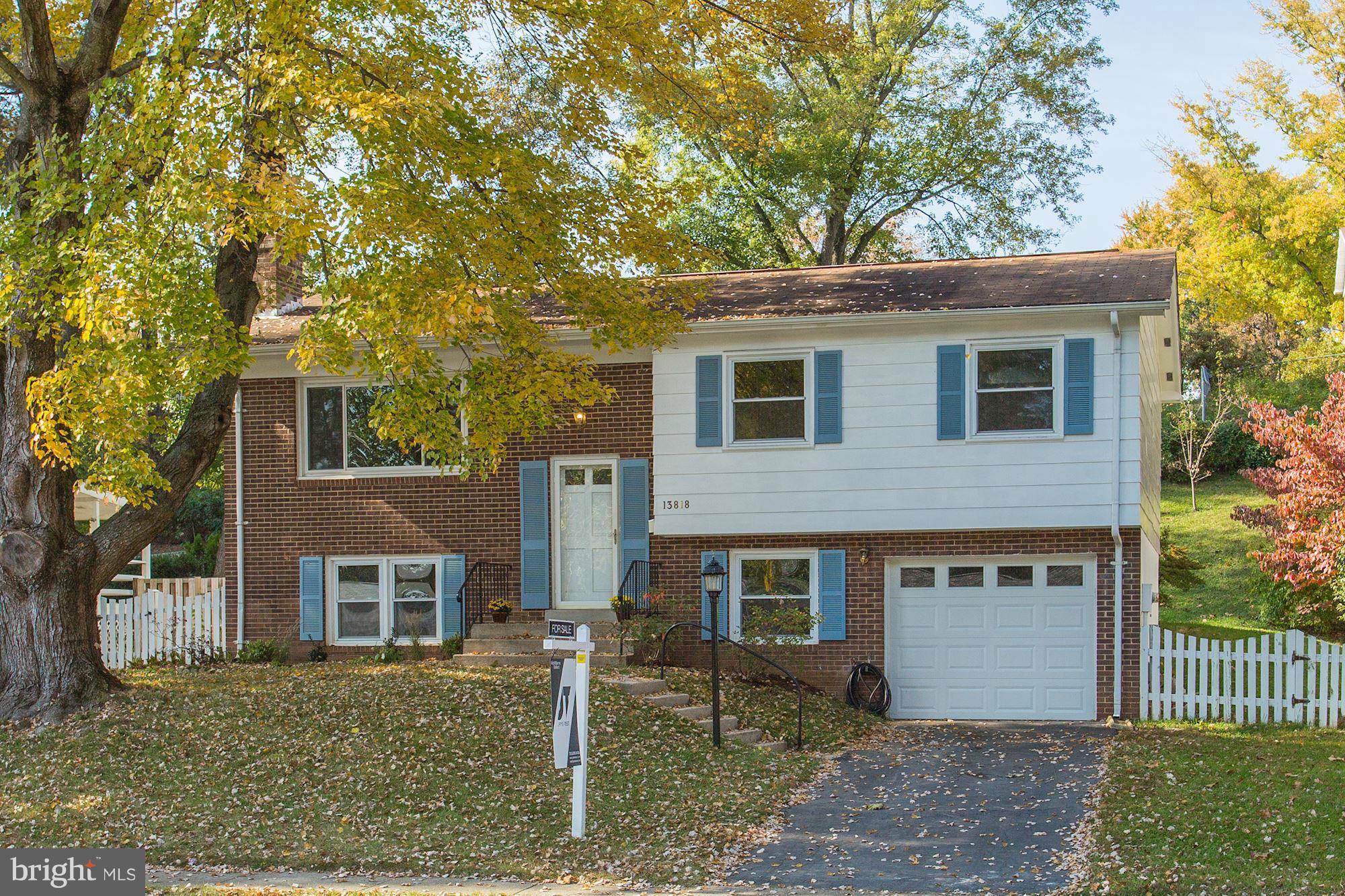 13818 Gilbert Road Woodbridge, VA 22193 - Photo 2 of 30 a front view of a house with garden