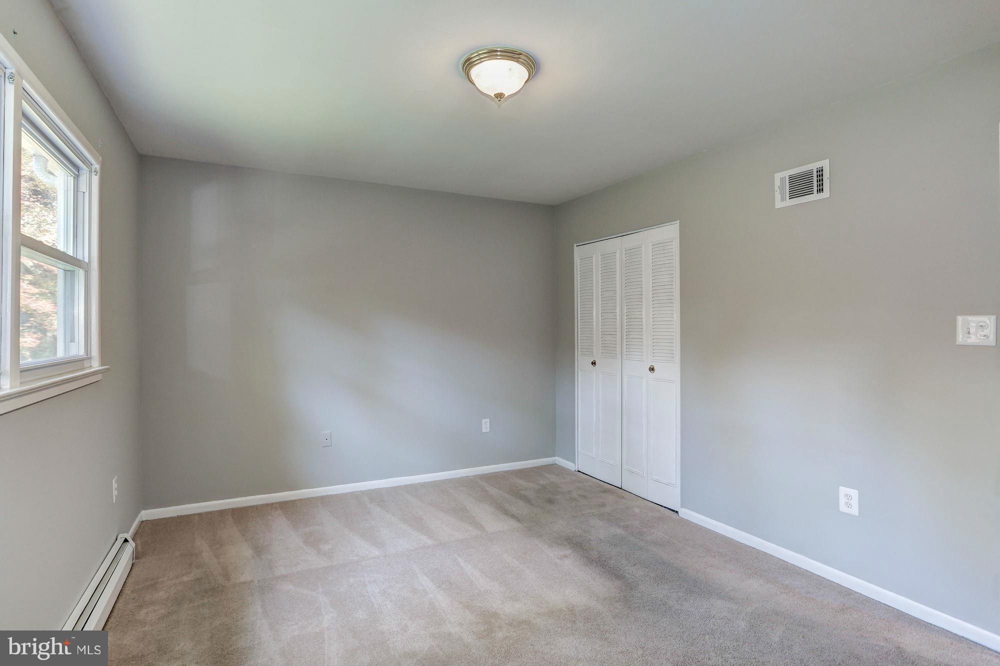 13818 Gilbert Road Woodbridge, VA 22193 - Photo 18 of 30 a view of an empty room with a window