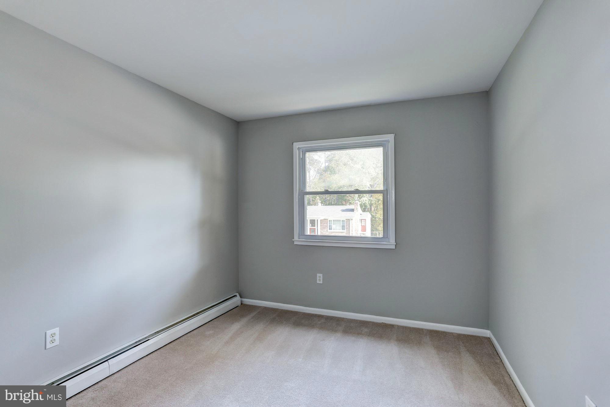 13818 Gilbert Road Woodbridge, VA 22193 - Photo 22 of 30 an empty room with a window
