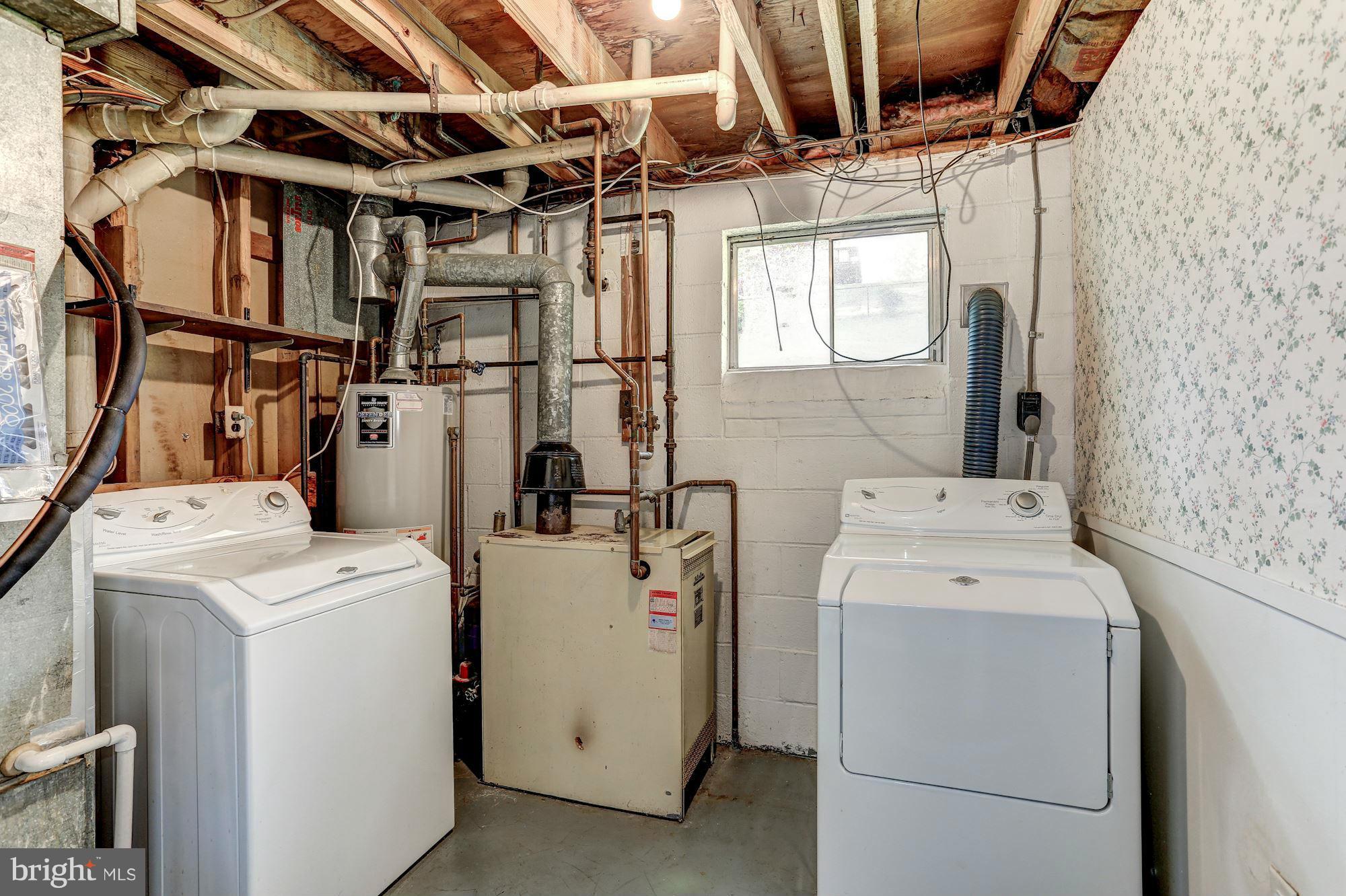 13818 Gilbert Road Woodbridge, VA 22193 - Photo 30 of 30 a utility room with dryer and washer