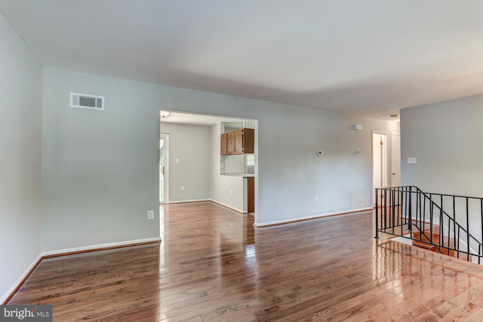 13818 Gilbert Road Woodbridge, VA 22193 - Photo 7 of 30 a view of empty room with wooden floor