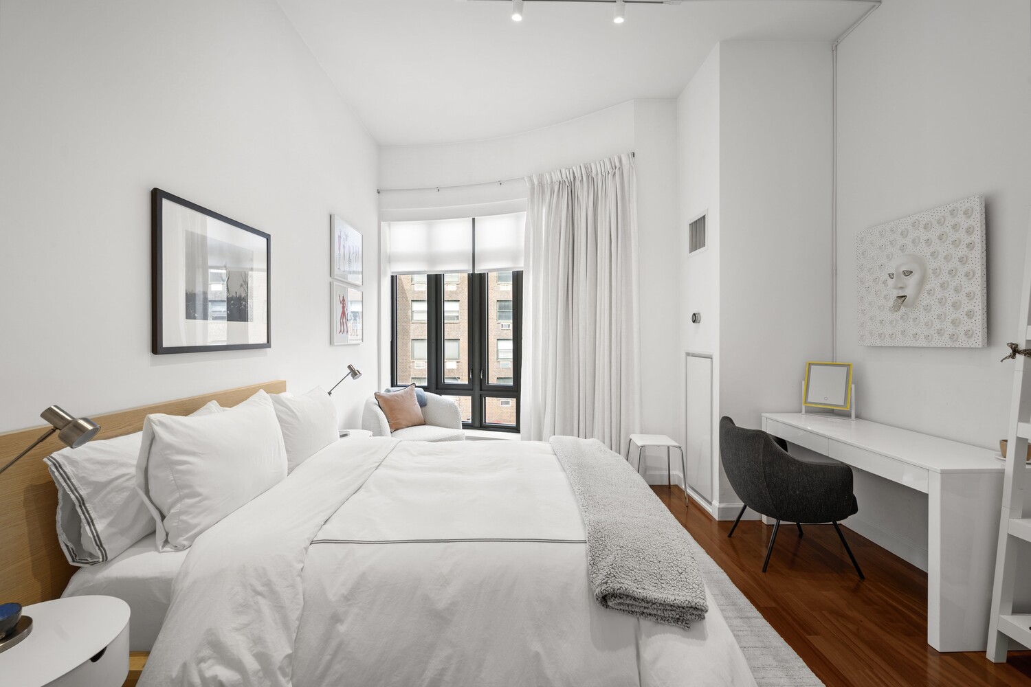 3 Morton Square Manhattan, NY 10014 - Photo 17 of 26 a large bedroom with a bed and a table