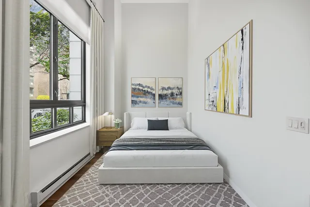 a view of a bedroom with windows