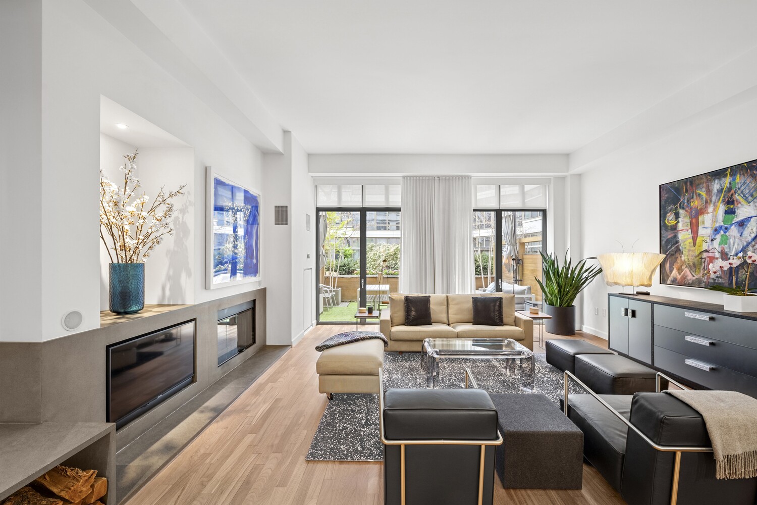 3 Morton Square Manhattan, NY 10014 - Photo 4 of 26 a living room with furniture a flat screen tv and a large window