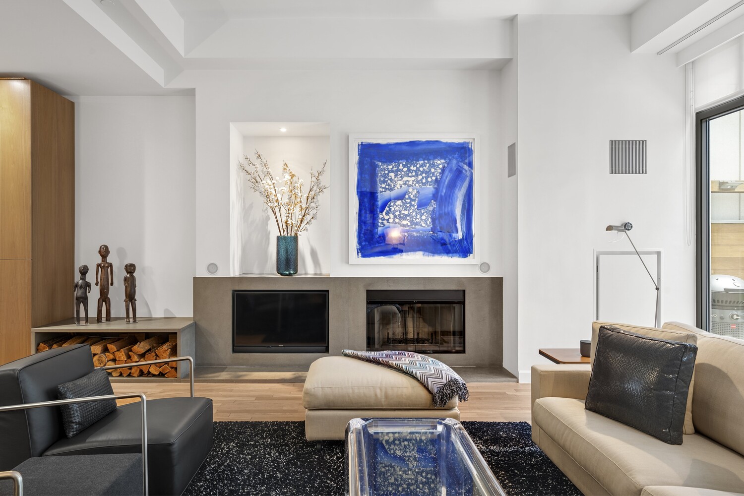 3 Morton Square Manhattan, NY 10014 - Photo 5 of 26 a living room with furniture a flat screen tv and a fireplace