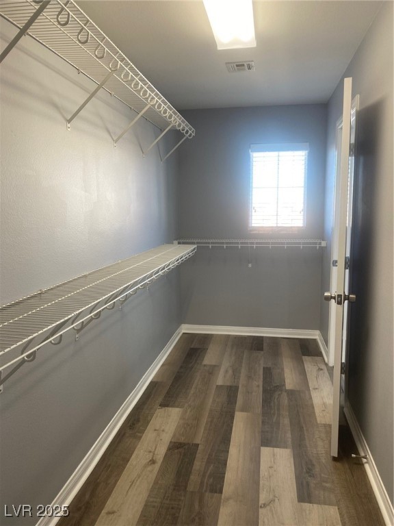9541 Vast Valley Avenue Las Vegas, NV 89148 - Photo 17 of 32 Walk in closet with dark wood finished floors