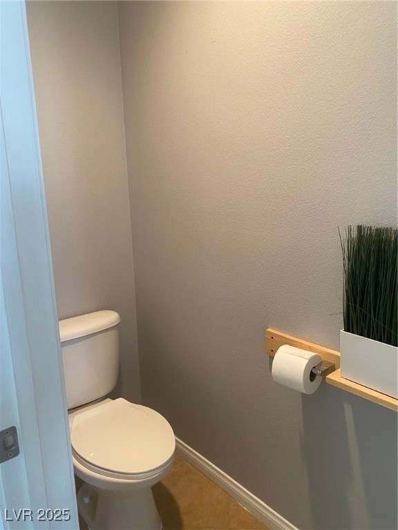 9541 Vast Valley Avenue Las Vegas, NV 89148 - Photo 20 of 32 Bathroom featuring toilet and tile patterned flooring