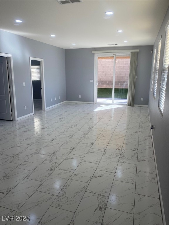 9541 Vast Valley Avenue Las Vegas, NV 89148 - Photo 23 of 32 Empty room featuring light marble finish floors and recessed lighting