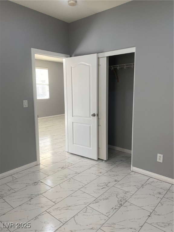 9541 Vast Valley Avenue Las Vegas, NV 89148 - Photo 25 of 32 Unfurnished bedroom with light marble finish flooring and a closet