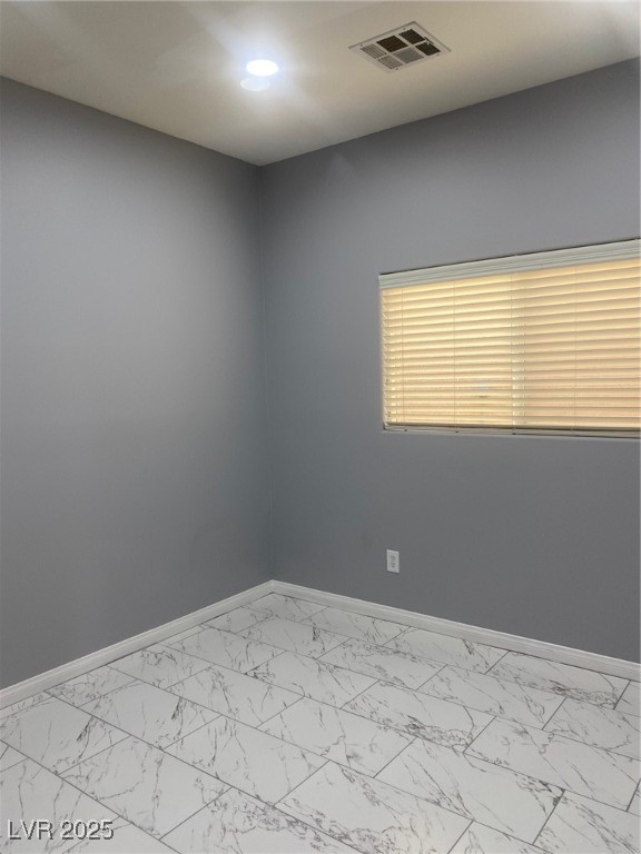 9541 Vast Valley Avenue Las Vegas, NV 89148 - Photo 29 of 32 Unfurnished room with baseboards and light marble finish flooring