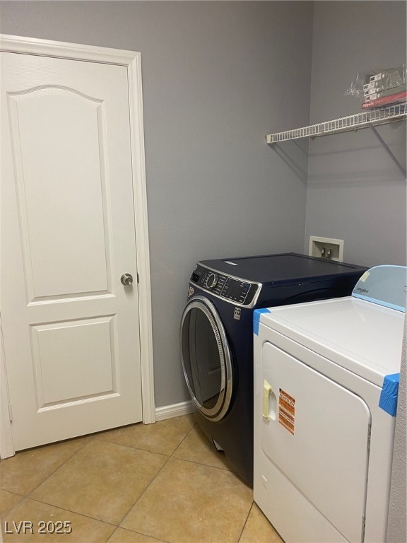 9541 Vast Valley Avenue Las Vegas, NV 89148 - Photo 32 of 32 Laundry room with light tile patterned flooring and independent washer and dryer