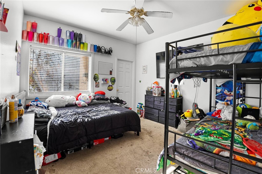 32245 Refa Street Wildomar, CA 92595 - Photo 14 of 35 a bedroom with bed and a window