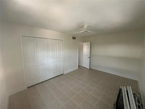 an empty room with staircase